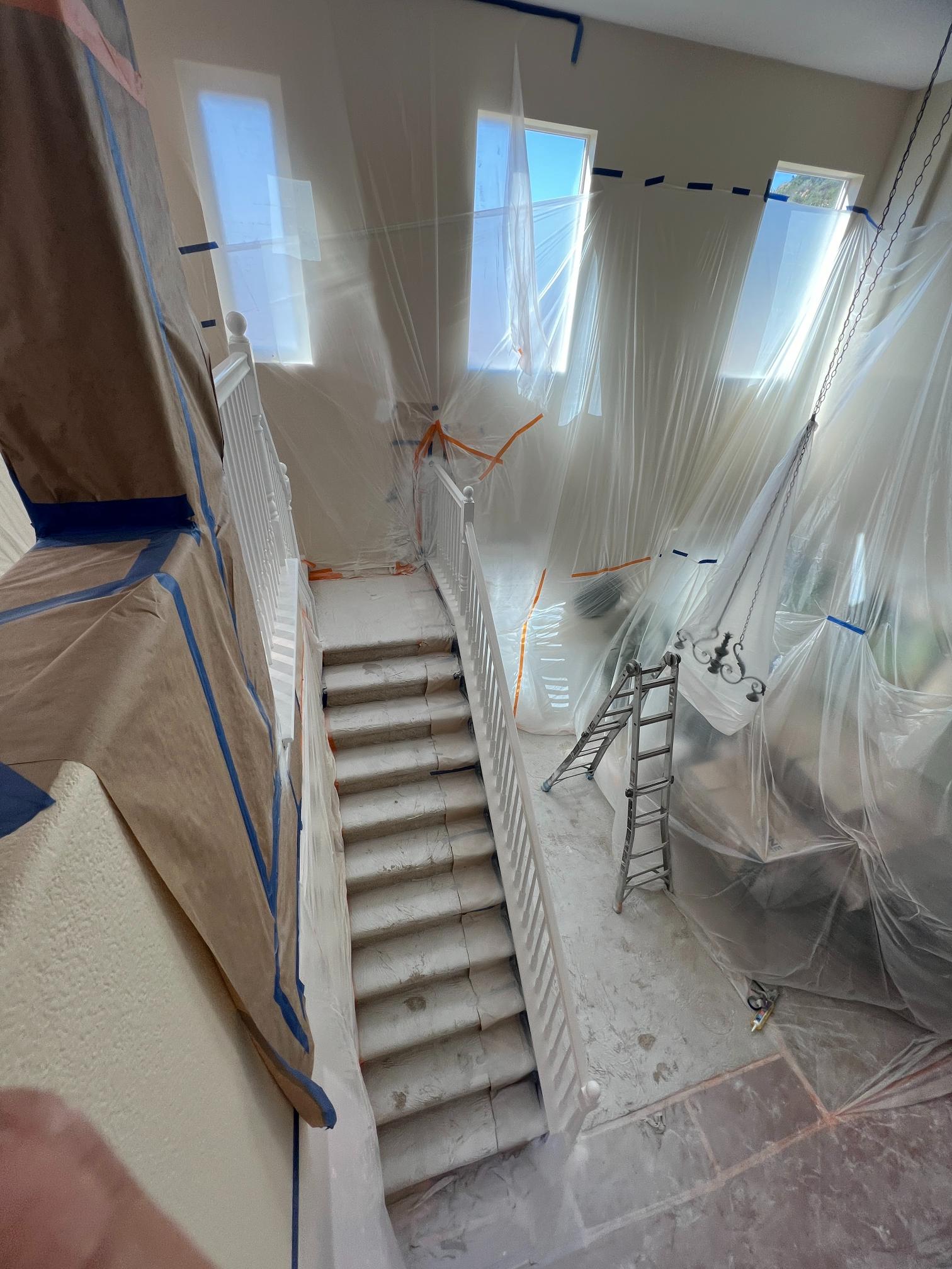 Interior staircase preparation for painting in San Diego by Monarch Painting with professional masking and protection.